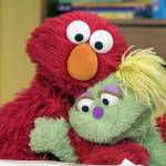 Sesame Workshop                                Elmo, left, hugs Karli, the new Muppet on the long-running PBS childrens show Sesame Street.