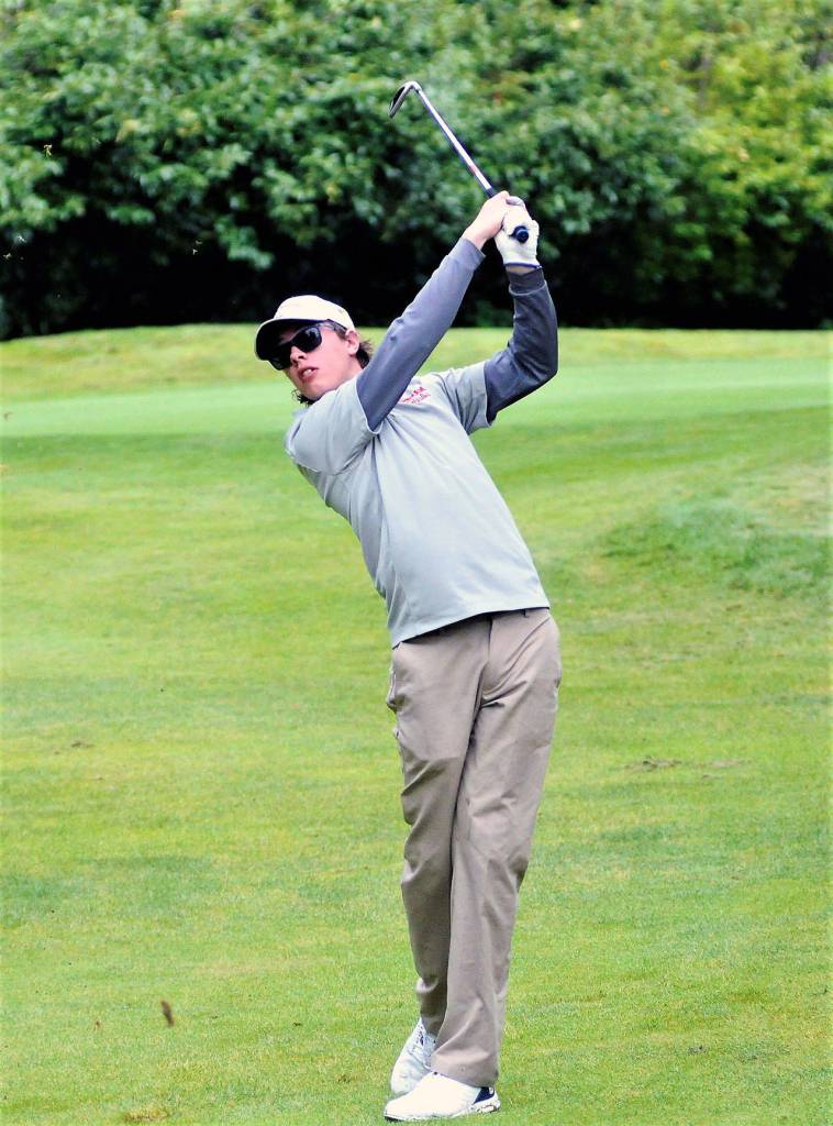Hoquiams Braden Dayton takes a shot from the fairway on the 11th hole at Olympia Country and Golf Club during the 1A State Tournament on Thursday. (Hasani Grayson | Grays Harbor News Group)
