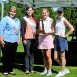 From left: WIAA Diary Farmers Ambassadors Natalie Dolman and Gabby Brockway, pose with Montesano golfers Mylaina Parker and Glory Grubb after the Bulldogs finished in fourth place at the 1A State Tournament in Tumwater on Wednesday. (Hasani Grayson | Grays Harbor News Group)