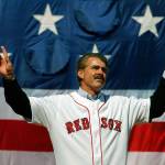 Former Boston Red Sox player Bill Buckner acknowledges the cheers from the crowd before throwing out the ceremonial first pitch at the MLB baseball game between the Boston Red Sox and Detroit Tigers on April 8, 2008 at Fenway Park in Boston, Massachusetts. Buckner passed away on Monday at the age of 69. (Brian Snyder-Pool | Getty Images/TNS)