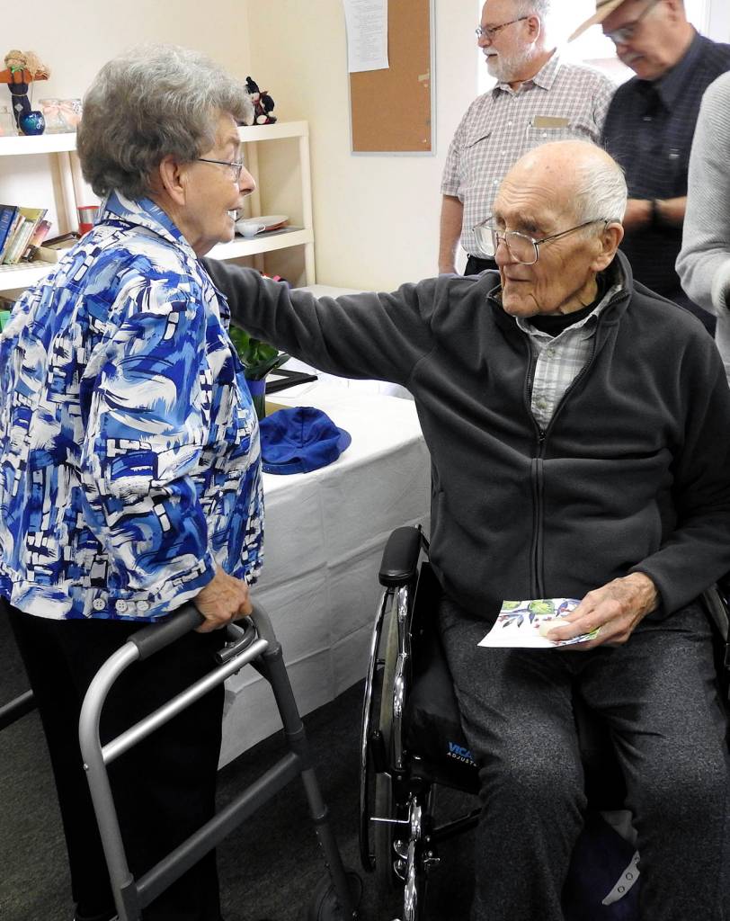 Kat Bryant | Grays Harbor News Group                                Lou Messmer shares a moment with clothing bank co-manager Mary Keinath, a longtime volunteer who also was Maryann Welchs third-grade teacher.