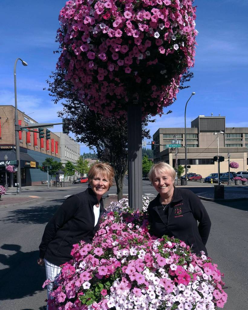 Kat Bryant | Grays Harbor News Group                                Bette Worth and her partner in pink, Bobbi McCracken, show off their Bloom Teams work in 2018.