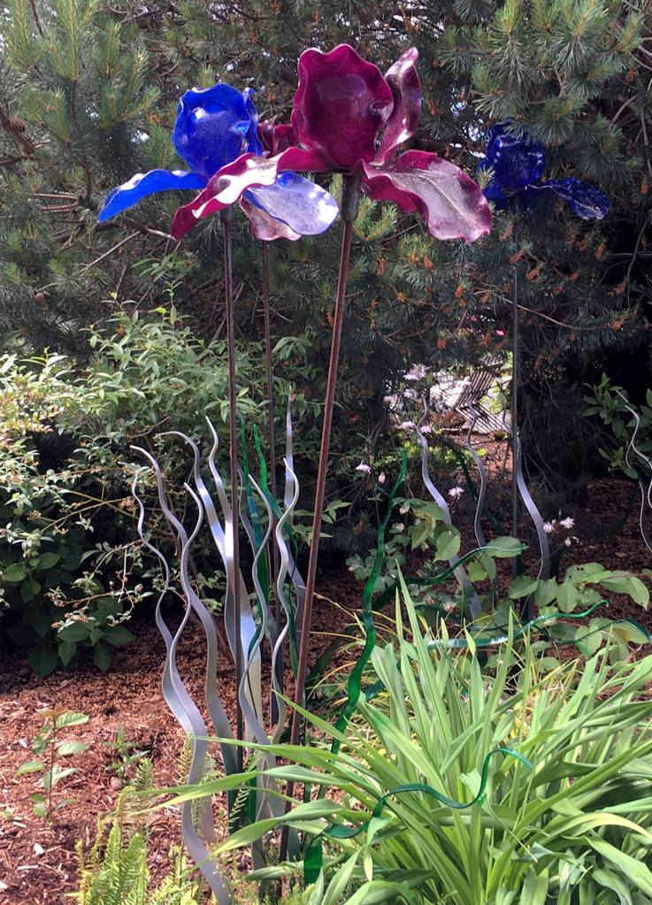 Kat Bryant | Grays Harbor News Group                                Artist Lora Malakoff created her tall Fleurs de Lis sculpture for the 2012 festival. It now stands at the edge of the seating area outside the restaurant.