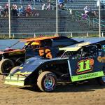 Tom Sweatman (11) battles for position with David Wolfard during the Modifieds feature race on Saturday at Grays Harbor Raceway in Elma. (Photo by AR Racing Videos)