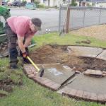 COURTESY MICHELLE AMES                                The existing Lindsey Baum memorial and its faded plaque were removed to make way for the new Lindsey Baum memorial garden at Beerbower Park in McCleary, which will be dedicated June 26. Arlee Rothwell, one of the many volunteers who worked on the garden, uses a sledgehammer to break up the old memorial.