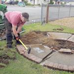 COURTESY MICHELLE AMES                                The existing Lindsey Baum memorial and its faded plaque were removed to make way for the new Lindsey Baum memorial garden at Beerbower Park in McCleary, which will be dedicated June 26. Arlee Rothwell, one of the many volunteers who worked on the garden, uses a sledgehammer to break up the old memorial.