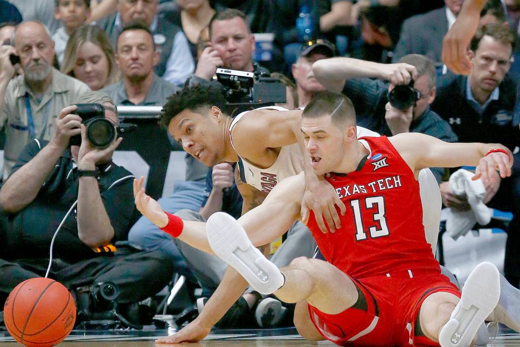 Luis Sinco/Los Angeles Times                                Gonzagas Brandon Clarke and Texas Techs Matt Mooney (13) battle for control of a loose ball.