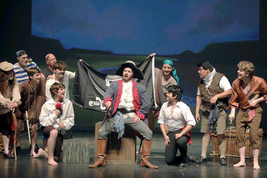 Photos by Keith J. Krueger                                The Pirate King (Jerrod Phelps, center) waxes poetic with his band.