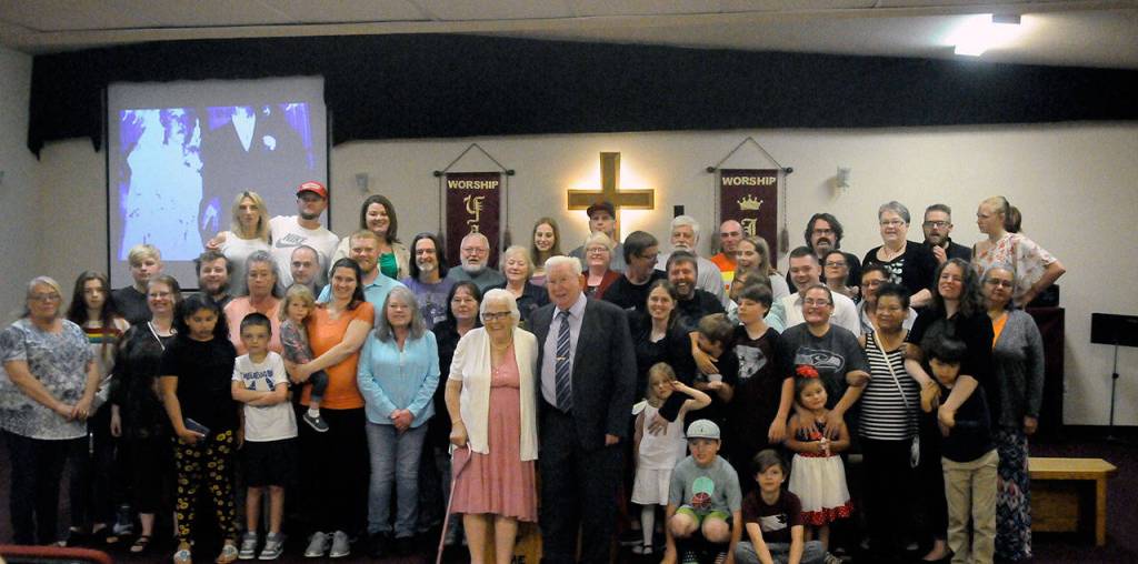 Delma and John Gilroy pose for a picture with family at the couples 70-year anniversary Lake Quinault Valley Chapel on Saturday. (Hasani Grayson | Grays Harbor News Group)