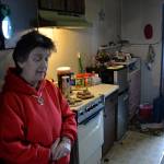 (Louis Krauss | Grays Harbor News Group) Karen Baker, 55, stands inside her room at the Kerns Motel.