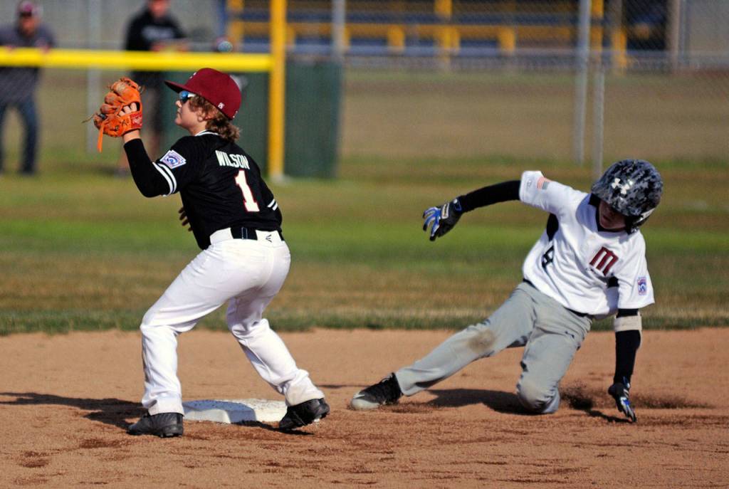 Montesanos Colton Grubb slides in to second base during the Bulldogs 11-10 victory over Chehalis on Friday. (Ryan Sparks | Grays Harbor News Group)