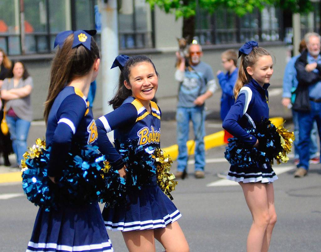 Aberdeen Middle School cheer leaders perform a routine during the Aberdeen Founders Day Parade on Saturday. (Hasani Grayson | Grays Harbor News Group)