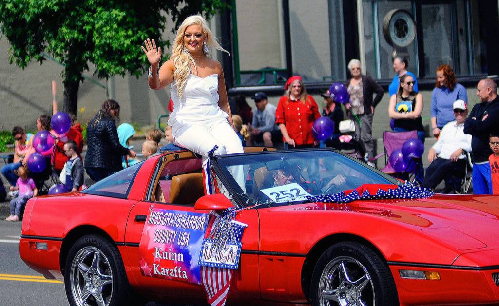 Miss Grays Harbor County USA winner Kuinn Karaffa waves to the crows during the Aberdeen Founders Day Parade on Saturday. (Hasani Grayson | Grays Harbor News Group)