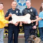COURTESY CLARA GILLIES                                The Aberdeen Lions Club recently made a donation to the Aberdeen Police Department in support of K-9 Officer Ronin. The funds have been earmarked for training supplies and other needed equipment. Pictured from left are Lions Club President Aaron Gillies, Police Chief Steve Shumate, Officer Chad Pearsall with K-9 Officer Ronin, and Lion Kellie Dawson.