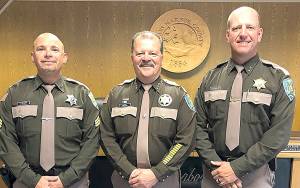 COURTESY GRAYS HARBOR COUNTY SHERIFFS OFFICE                                Grays Harbor County Sheriff Rick Scott, center, promoted Brad Johansson, right, to undersheriff and Carson Steiner to sergeant on July 1.