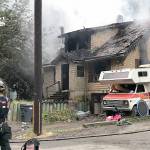 COURTESY DANNETTE HAGGERTY                                Firefighters tend to a house fire in the 900 block of Duffy Street in Aberdeen Thursday morning. Five of the seven occupants suffered varying degrees of burns. Two children and one adult were sent to Harborview Medical Center in Seattle for further treatment.