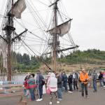 DAN HAMMOCK | GRAYS HARBOR NEWS GROUP                                Ticket holders wait in line to board the tall ship Lady Washington at the Grays Harbor Historical Seaport for the fireworks sail Thursday.