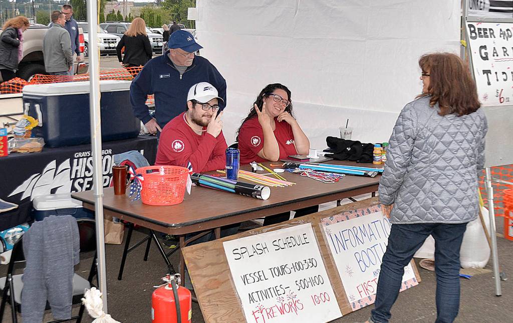 Staff from the Grays Harbor Historical Seaport sell tickets for tours aboard the tall ship Lady Washington during the Splash Festival.