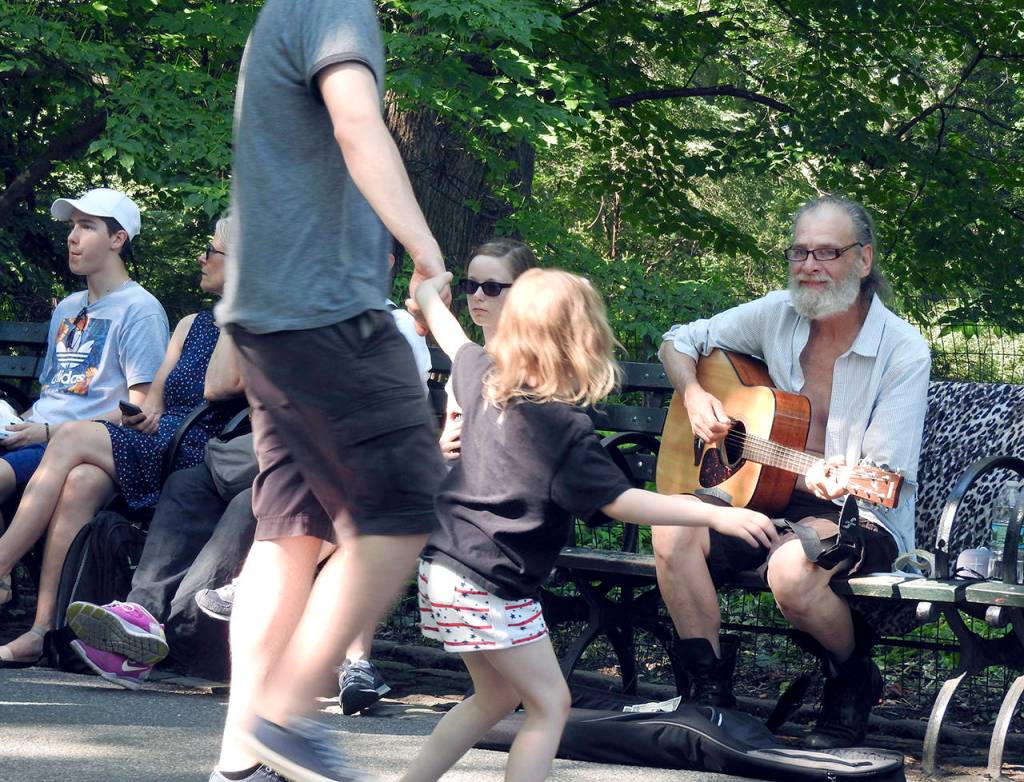 Those visiting the Strawberry Fields area of Central Park with me were treated to this 
soft-spoken buskers acoustic renditions of Beatles songs.