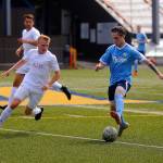Grays Harbors Jordan Hamblin looks for room to run around midfield in the first half against Redmond on Saturday at Stewart Field. (Hasani Grayson | Grays Harbor News Group)