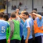 Grays Harbors Gulls players and coaches break the huddle at halftime of a game against Redmond on July 6. (Hasani Grayson | Grays Harbor News Group)