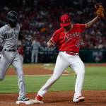 The Seattle Mariners Dee Gordon, left, is forced out at first base by Los Angeles Angels pitcher Felix Pena in the third inning at Angel Stadium in Anaheim, Calif., on Friday, July 12, 2019. (Kent Nishimura/Los Angeles Times/TNS)