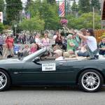 DAN HAMMOCK | GRAYS HARBOR NEWS GROUP                                McCleary Mayor Brenda Orffer tosses candy at the crowd of families at the head of the McCleary Bear Festival parade Saturday.