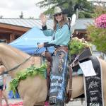 DAN HAMMOCK | GRAYS HARBOR NEWS GROUP                                Grays Harbor Mounted Posse Rodeo Queen Tessa Watson waves to the big crowd lining West Simpson during the McCleary Bear Festival parade Saturday.