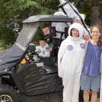 Photos by DAN HAMMOCK | GRAYS HARBOR NEWS GROUP                                ABOVE LEFT: Julia, Ella and Emelia Carnell went all out for their entry in Saturdays McCleary Bear Festival parade with this nod to the anniversary of the moon landing. Seated in the lunar rover is Zane Zabala. ABOVE RIGHT: The royal court for the 2019 McCleary Bear Festival winds its way through town during the parade Saturday.