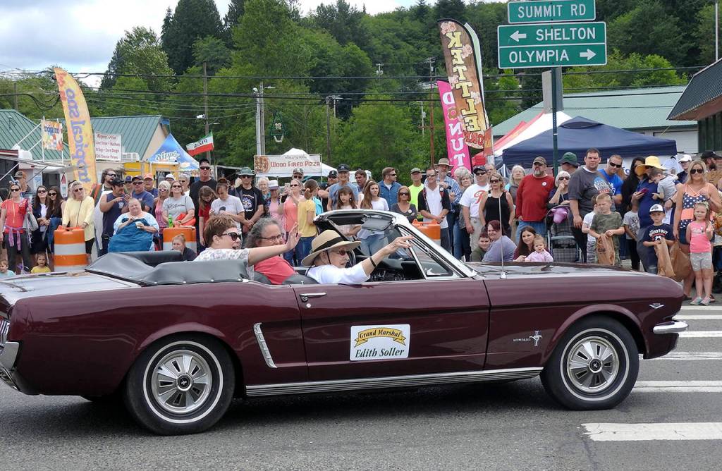 KAT BRYANT | GRAYS HARBOR NEWS GROUP                                Grand Marshal Edith Soller waves from a classic Ford Mustang during the Bear Festival grand parade on Saturday.
