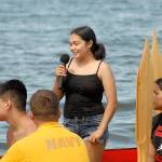 Kanani Wells of the Quinault Nation asks permission for her tribes canoe to come ashore at Jamestown Beach north of Sequim on Tuesday during a 2019 Canoe Journey visit to the Jamestown SKlallam Tribe. (Keith Thorpe/Peninsula Daily News)