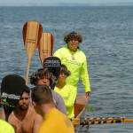 Anela Gutierrez of the Autumn Rose canoe of Maui, Hawaii, asks for permission for her canoe to come ashore at Jamestown Beach north of Sequim on Tuesday. (Keith Thorpe/Peninsula Daily News)