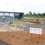 Photos by Michael Lang | Grays Harbor News Group                                LeMays Grays Harbor Transfer Station nears completion Friday, July 12, at 29 Gavett Lane west of Montesano. The station opens Aug. 1 near the National Guard Armory on Clemons Road. At the left are the public scales, at the right is the structure that will cover the recycling receptacles.