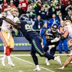 Seattle Seahawks defensive tackle Jarran Reed pressures San Francisco 49ers quarterback Nick Mullens during a game on Sunday, Dec. 2, 2018. Reed was suspended by the NFL on Monday. (Bettina Hansen/Seattle Times/TNS)