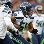 Seattle Seahawks Bobby Wagner (54) runs with the ball after an interception against the San Francisco 49ers on Sunday, Nov. 26, 2017. According to reports, Wagner will join the Seahawks at training camp whether he has a new contract or not. (Josie Lepe/Bay Area News Group/TNS)