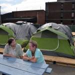 (Louis Krauss | Grays Harbor News Group) Kenny Miotke, left, 64, talks with Lisa Celeste, 59, at the tent shelter behind Aberdeen City Hall.