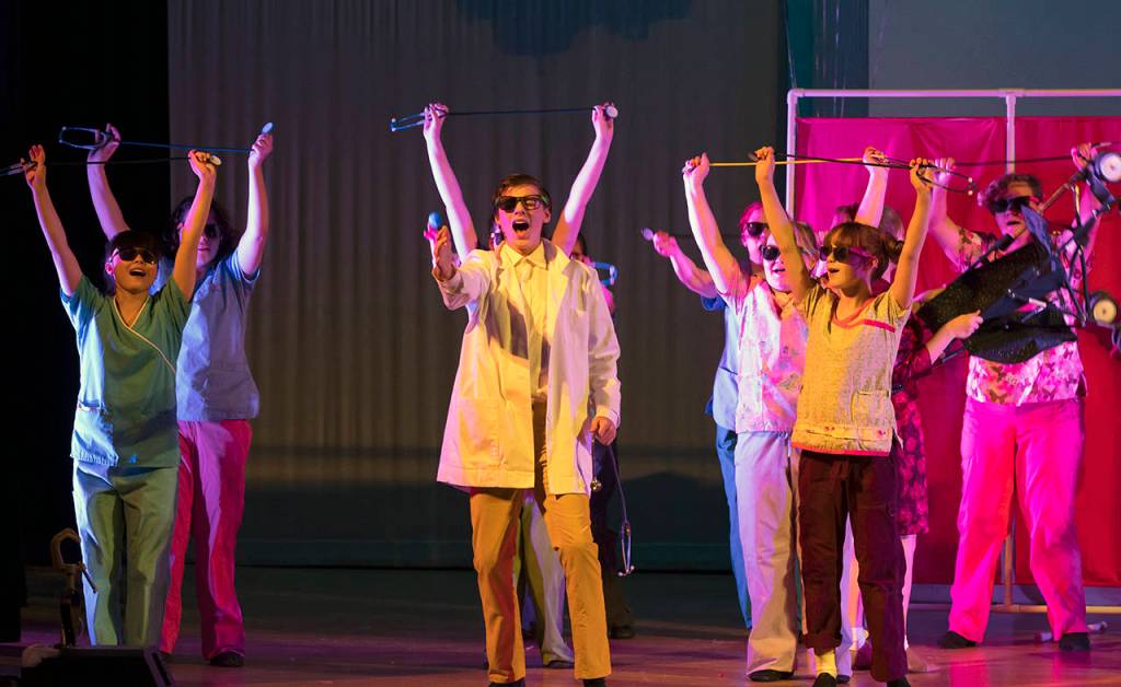 The Doctor (Evan Weidman) and the RNs perform a number.