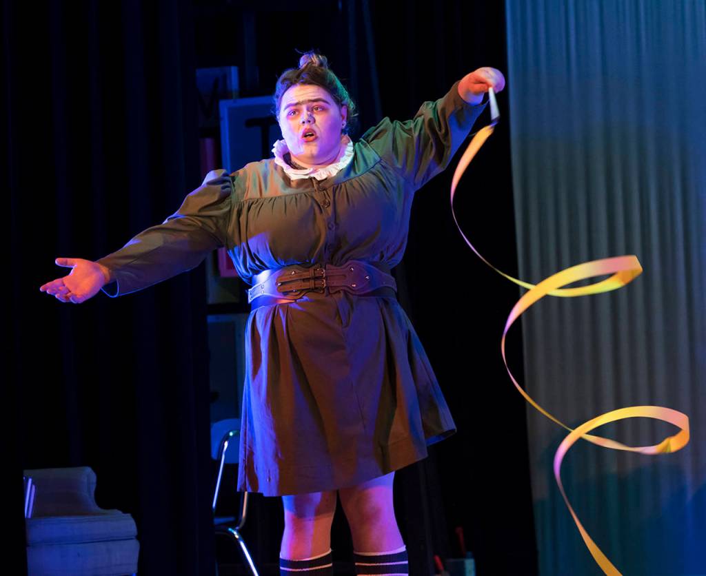 Miss Trunchbull (Aiden Brown) twirls a ribbon.