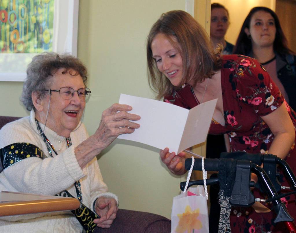 Ruth McCausland receives a birthday card from granddaughter Meghan McCausland.