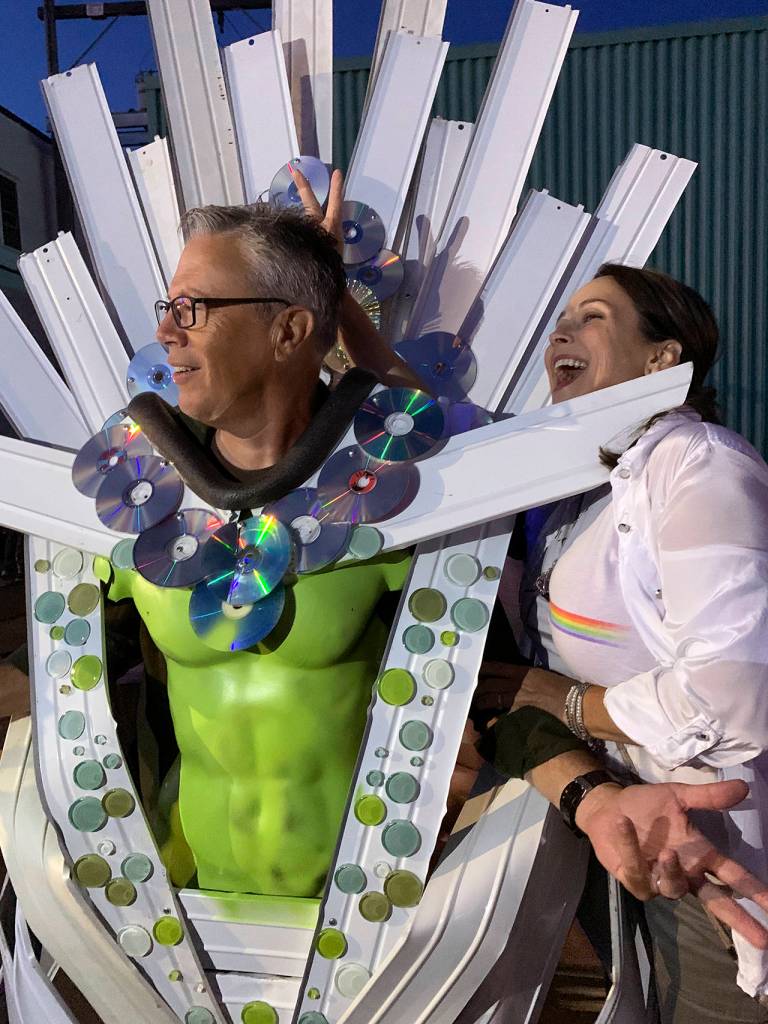 Wil Russoul and wife Kristi Daniels enjoyed one of the step-in costumes set up along K Street.