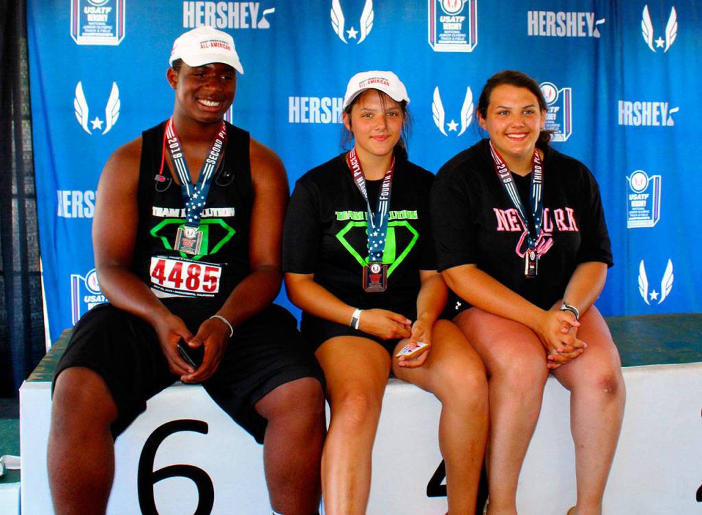 From left: Team Evolutions JaBron Brooks, Mataya Straka and Tyara Straka pose for a photo with their medals after competing at the USATF Junior Olympic National Championships on Sunday in Sacramento, Calif. (Submitted Photo)
