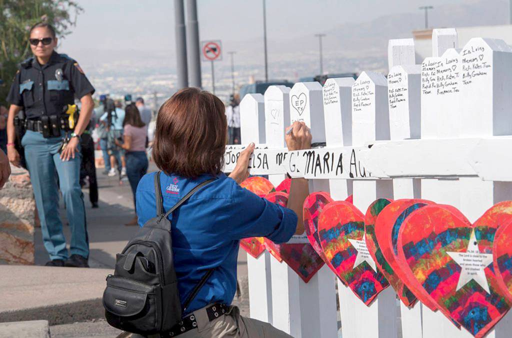 Mark Ralston/Getty Images                                Members of the Crosses for Losses group arrive at the scene with crosses Monday for each victim, after the shooting that left 21 people dead at the Cielo Vista Mall Walmart in El Paso, Texas.