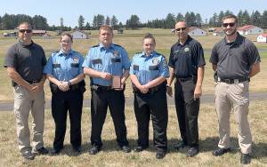 COURTESY PHOTO                                From left: Aberdeen Police Explorer Advisor Det. Jeff Weiss, Explorer Winnie Fruh, Explorer Tagg Meneely, Explorer Abigail Twibell, Aberdeen Police Chief Steve Shumate and Aberdeen Police Explorer Advisor Officer Dillon Mitchell.