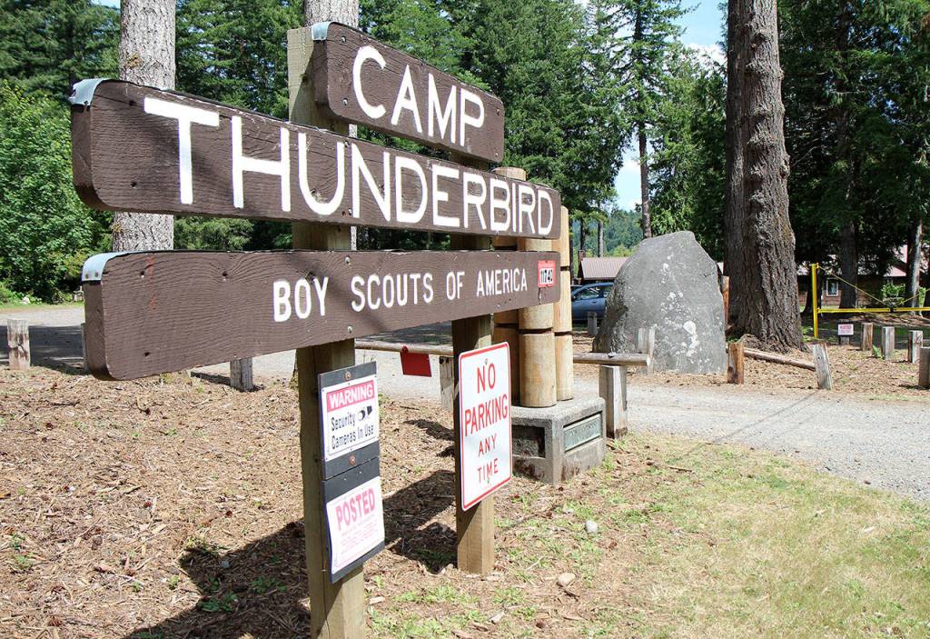 Photos by Michael Lang | Grays Harbor News Group                                The Boy Scouts of Americas Camp Thunderbird at Summit Lake in Thurston County has played host to Pioneer Rock since the 1990s. Two area men hope to move the 29-ton granite rock  seen July 24, to the right of the sign  to the rest area east of Elma.