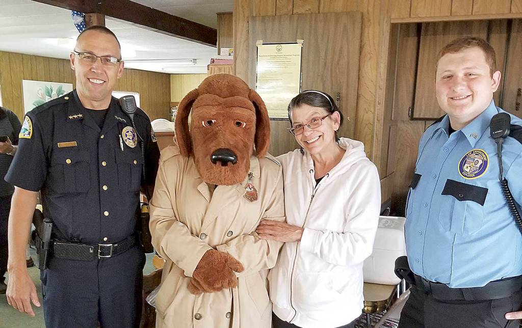COURTESY ABERDEEN POLICE DEPARTMENT                                There were at least 12 gatherings throughout the Aberdeen area during National Night Out Tuesday, according to the Aberdeen Police Department. Members of the Police Explorer Post escorted McGruff the Crime Dog to various locations, here with Police Chief Steve Shumate at one of the stops.