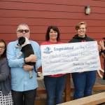 Photo by Todd Arend                                From left: Saengchanh Viengxay, casino marketing manager; Johnny Winokur, casino general manager and Willapa Bay Enterprises CEO; Tracie Kulich, PAWS animal services director; Dana Staab Erickson, PAWS executive director; and Tessa Davis, casino HR manager.
