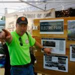 photos by Hasani Grayson | Grays Harbor News Group                                LEFT: From left, Hoquiam Mayor Jasmine Dickhoff, City Council member Ben Winkelman, Police Chief Jeff Myers and City Council member Steven Puvogel celebrate winning the trivia competition during the Myrtle Street Dance on Saturday.                                 ABOVE: Polson Museum director John Larson talks about the history of Electric Park during the Myrtle Street Dance on Saturday.