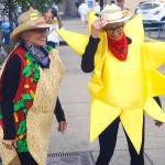 Sumerfest co-founders Bobbi McCracken, left, and Bette Worth take in the event with festive western-themed costumes Saturday. (Hasani Grayson | Grays Harbor News Group)