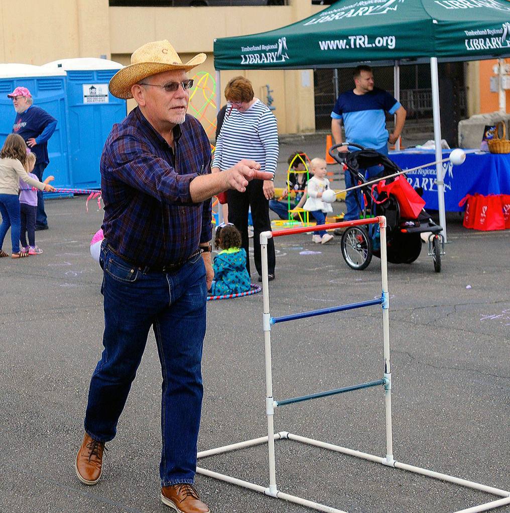 County Commissioner Randy Ross plays a game at Summerfest.