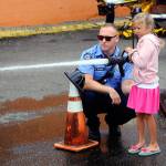 Emmalynn gets her chance to use a firehose from of fire truck from the Aberdeen Fire Department at Summerfest on Saturday. (Hasani Grayson | Grays Harbor News Group)